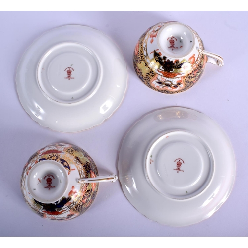 209 - Royal Crown Derby pair of pedestal teacups and saucers painted with imari pattern 9022.