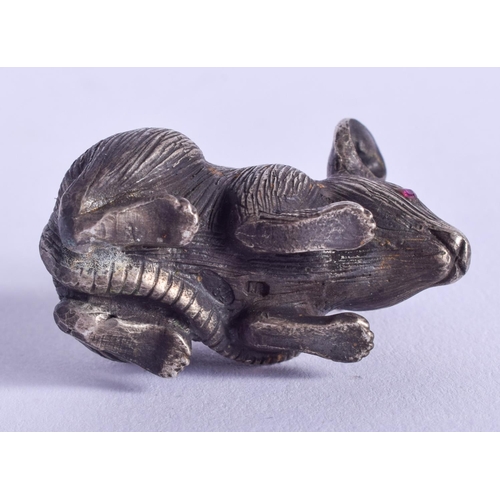 2097 - A SMALL CONTINENTAL SILVER FIGURE OF A MOUSE with ruby eyes. 59 grams. 3 cm x 2 cm.