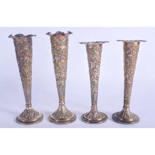 2104 - FOUR ANTIQUE MIDDLE EASTERN INDIAN SILVER VASES decorated with foliage. 918 grams loaded. Largest 18... 