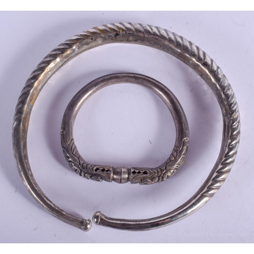 2137 - TWO SOUTH EAST ASIAN BANGLES. 80 grams. Largest 14 cm wide. (2)