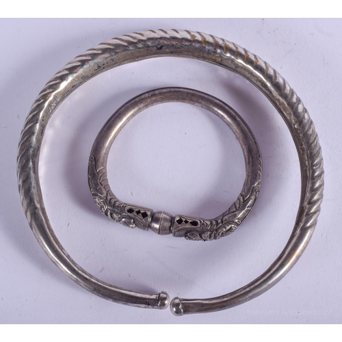 2137 - TWO SOUTH EAST ASIAN BANGLES. 80 grams. Largest 14 cm wide. (2)