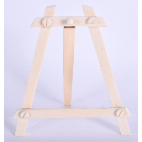 2138 - AN EDWARDIAN IVORY EASEL. 13 cm x 13 cm.