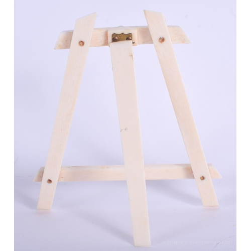 2138 - AN EDWARDIAN IVORY EASEL. 13 cm x 13 cm.