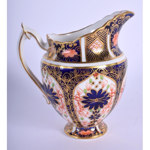 214 - Royal Crown Derby pedestal cream jug painted with imari pattern 1128. 12 cm high