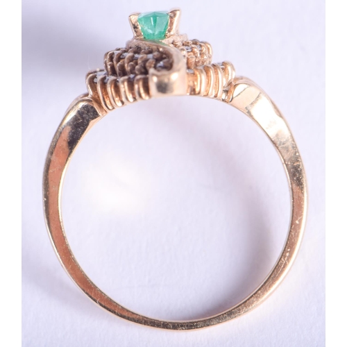 2144 - A 14CT GOLD DIAMOND AND EMERALD RING. 4.3 grams. N.