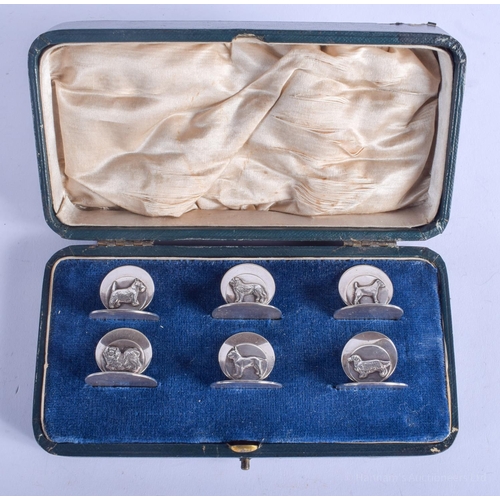 2154 - A RARE SET OF SIX 1970S ENGLISH SILVER MENU HOLDERS decorated with dogs. London 1978. 117 grams. 2.7... 