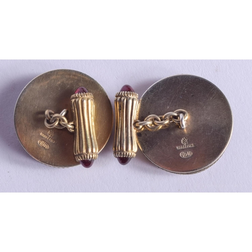 2159 - A PAIR OF CONTINENTAL SILVER GILT AND RUBY CUFFLINKS. 38 grams. 2.5 cm diameter.