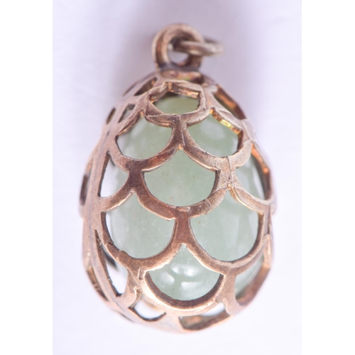 2161 - A CONTINENTAL SILVER AND JADE EGG PENDANT. 5.8 grams. 1.5 cm x 1 cm.