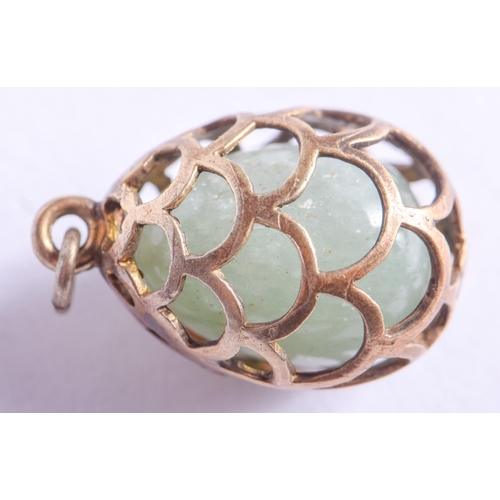 2161 - A CONTINENTAL SILVER AND JADE EGG PENDANT. 5.8 grams. 1.5 cm x 1 cm.