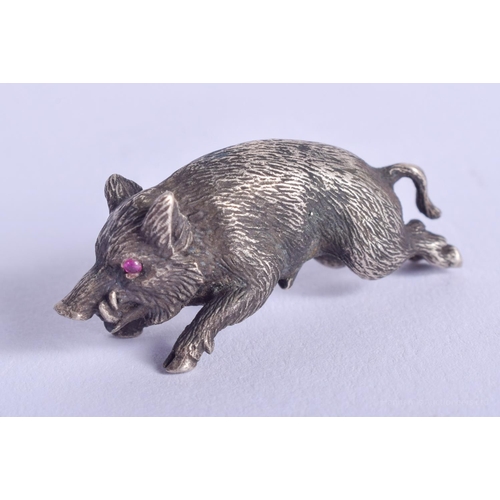 2169 - A SMALL CONTINENTAL SILVER HOG with ruby eyes. 16 grams. 3 cm x 0.5 cm.