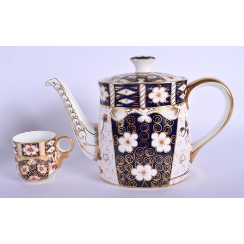 217 - Royal Crown Derby coffee pot and cover painted with imari pattern 2451 date code 1972 and a coffee c... 