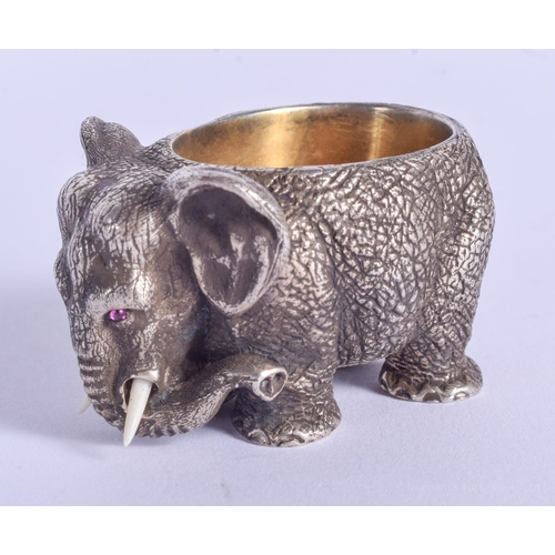 2170 - A CONTINENTAL SILVER ELEPHANT SALT with ruby eyes. 157 grams. 4.5 cm x 3 cm.