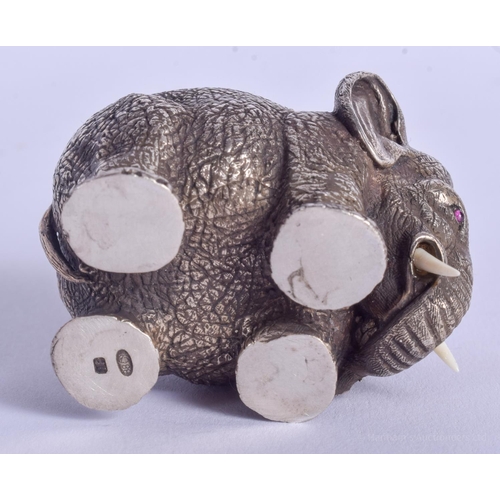 2170 - A CONTINENTAL SILVER ELEPHANT SALT with ruby eyes. 157 grams. 4.5 cm x 3 cm.