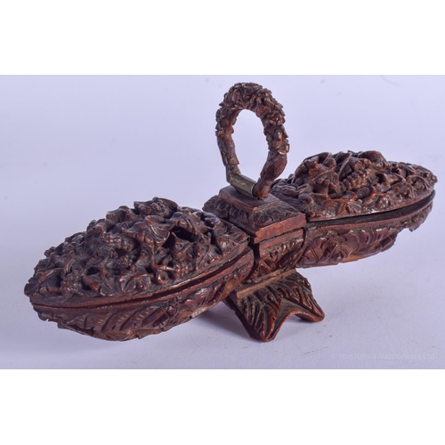 2176 - A GOOD 19TH CENTURY CONTINENTAL CARVED FRUIT COQUILLA NUT SNUFF BOX with double ends. 15 cm x 4 cm.