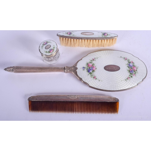 2190 - AN ANTIQUE SILVER AND ENAMEL DRESSING TABLE SET decorated with foliage. 460 grams overall. Largest 3... 