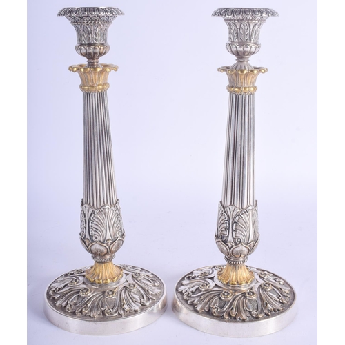 2192 - A FINE PAIR OF 19TH CENTURY FRENCH SILVER PLATED CANDLESTICKS overlaid in acanthus. 29 cm high.