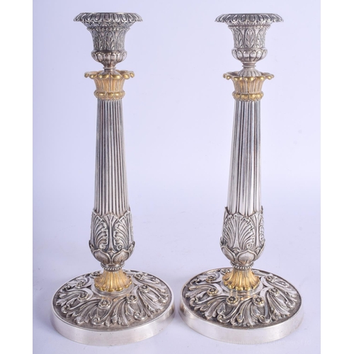 2192 - A FINE PAIR OF 19TH CENTURY FRENCH SILVER PLATED CANDLESTICKS overlaid in acanthus. 29 cm high.