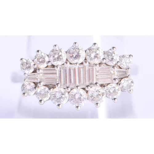 2197 - AN 18CT GOLD AND DIAMOND BAGUETTE CUT RING. 6.2 grams. S/T.