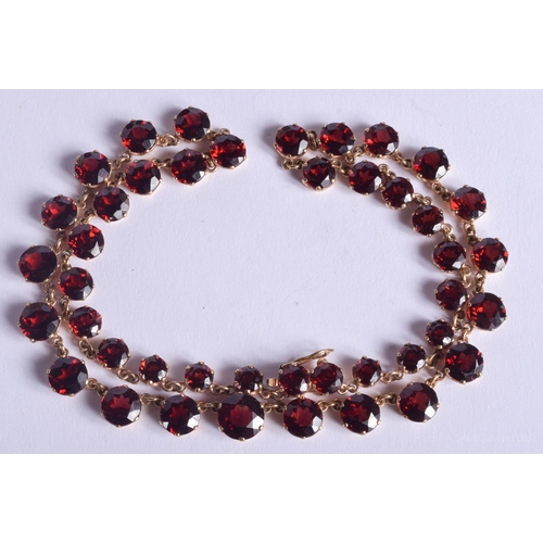 2223 - AN ANTIQUE GOLD MOUNTED GARNET NECKLACE. 31.4 grams. 4.4 cm x 0.6 cm, largest garnet 0.6 cm x 0.6 cm... 