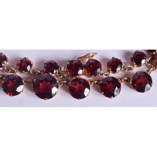 2223 - AN ANTIQUE GOLD MOUNTED GARNET NECKLACE. 31.4 grams. 4.4 cm x 0.6 cm, largest garnet 0.6 cm x 0.6 cm... 