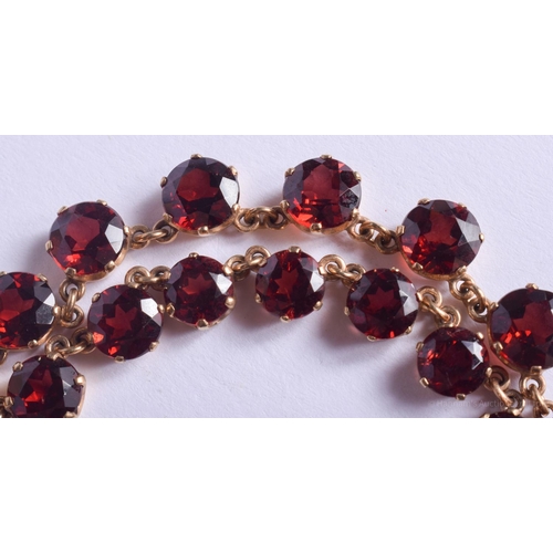 2223 - AN ANTIQUE GOLD MOUNTED GARNET NECKLACE. 31.4 grams. 4.4 cm x 0.6 cm, largest garnet 0.6 cm x 0.6 cm... 