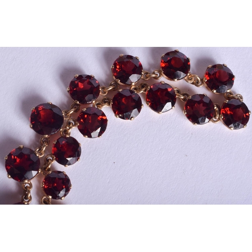 2223 - AN ANTIQUE GOLD MOUNTED GARNET NECKLACE. 31.4 grams. 4.4 cm x 0.6 cm, largest garnet 0.6 cm x 0.6 cm... 