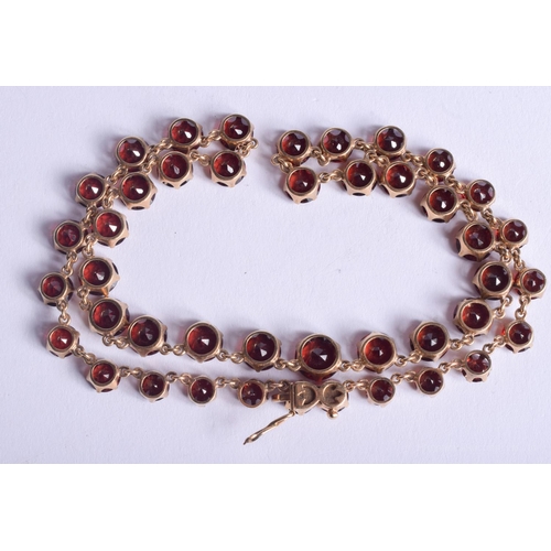 2223 - AN ANTIQUE GOLD MOUNTED GARNET NECKLACE. 31.4 grams. 4.4 cm x 0.6 cm, largest garnet 0.6 cm x 0.6 cm... 