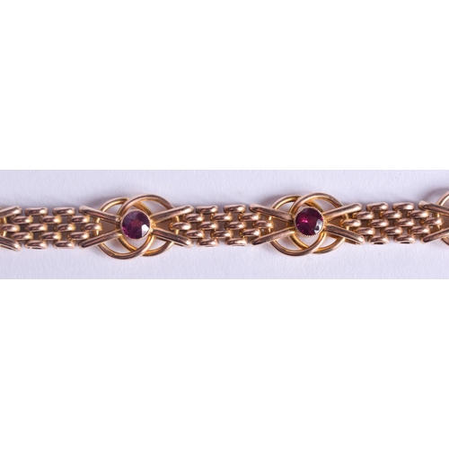 2224 - AN ANTIQUE 9CT GOLD AND AMETHYST BRACELET. 14.3 grams. 19.5 cm x 1.2 cm.