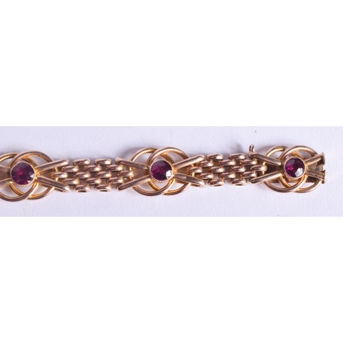 2224 - AN ANTIQUE 9CT GOLD AND AMETHYST BRACELET. 14.3 grams. 19.5 cm x 1.2 cm.