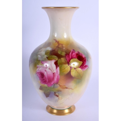 242 - Royal Worcester vase of baluster shape painted with roses by R. Austin date code 1923. 19.5cm high