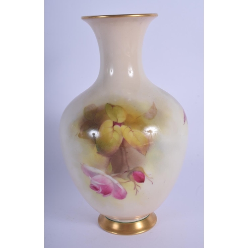 242 - Royal Worcester vase of baluster shape painted with roses by R. Austin date code 1923. 19.5cm high