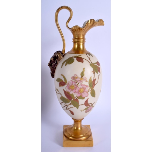 254 - Royal Worcester pedestal ewer with satyr mask handle terminus, painted with flowers on an ivory grou... 