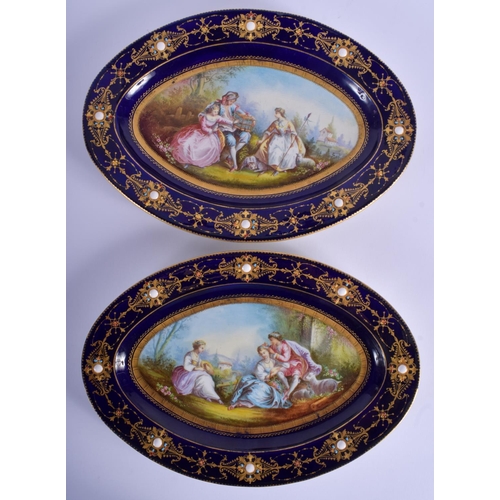 259 - A LARGE PAIR OF 19TH CENTURY SEVRES PORCELAIN DISHES painted with lovers, jewelled in landscapes. 31... 