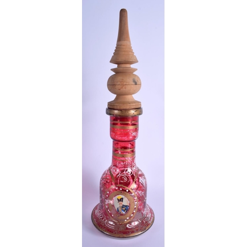 26 - AN ANTIQUE MIDDLE EASTERN PERSIAN RUBY GLASS HOOKAH PIPE BASE decorated with portraits. 47 cm high o... 