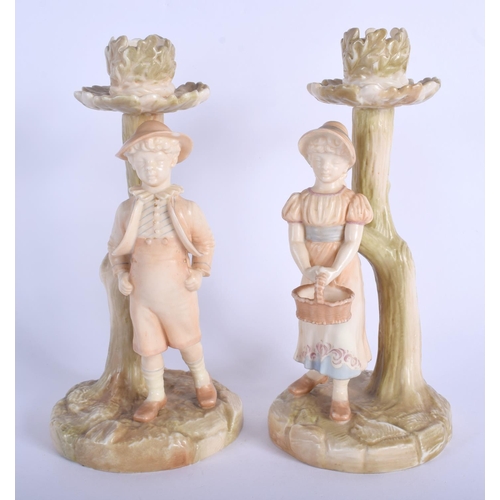 261 - Royal Worcester good Hadley pair of candle stick figures of a boy and girl date code for 1889. 19.5c... 