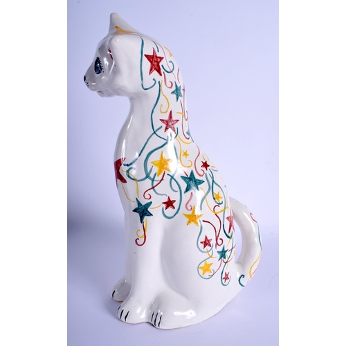 284 - A LARGE BRANNAM FIGURE OF A CAT painted with stars. 34 cm x 16 cm.