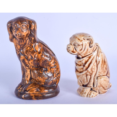 287 - A 19TH CENTURY ENGLISH TREACLE GLAZED POTTERY SPANIEL MONEY BOX together with another similar. Large... 