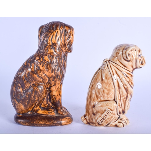 287 - A 19TH CENTURY ENGLISH TREACLE GLAZED POTTERY SPANIEL MONEY BOX together with another similar. Large... 