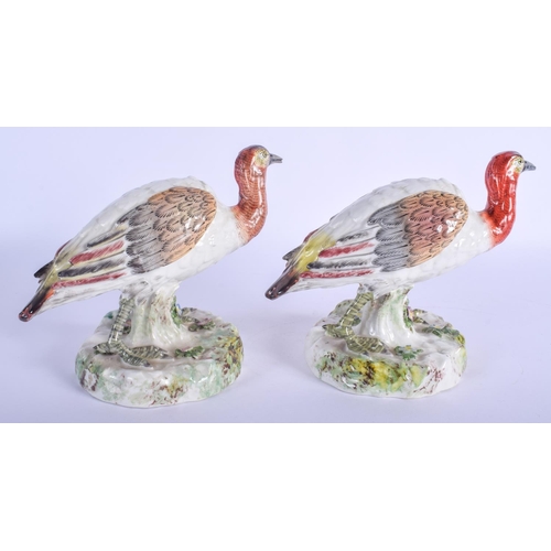 288 - A PAIR OF 19TH CENTURY CONTINENTAL PORCELAIN FIGURES OF BIRDS modelled upon naturalistic bases. 15 c... 