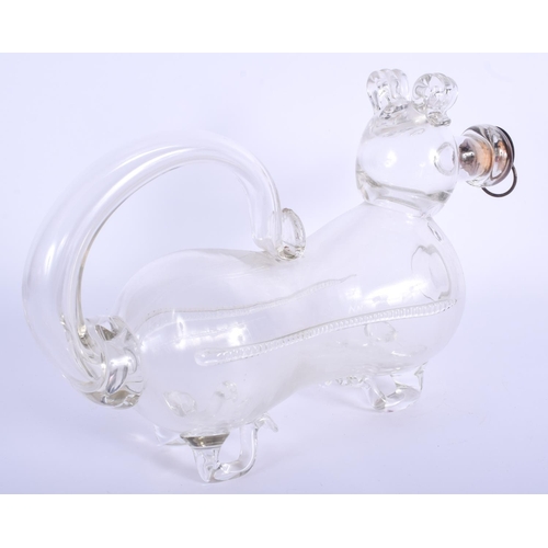 29 - AN ANTIQUE NOVELTY GLASS DECANTER in the form of a recumbent dog. 27 cm x 18 cm.