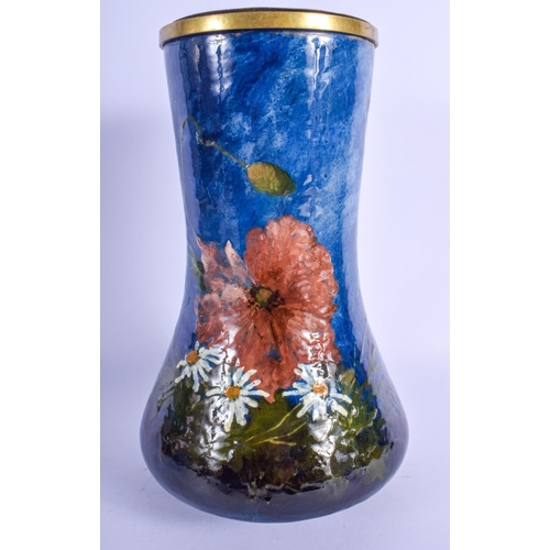 295 - AN ANTIQUE FRENCH ENAMELLED POTTERY VASE painted with foliage upon a blue ground, signed EG. 27 cm x... 