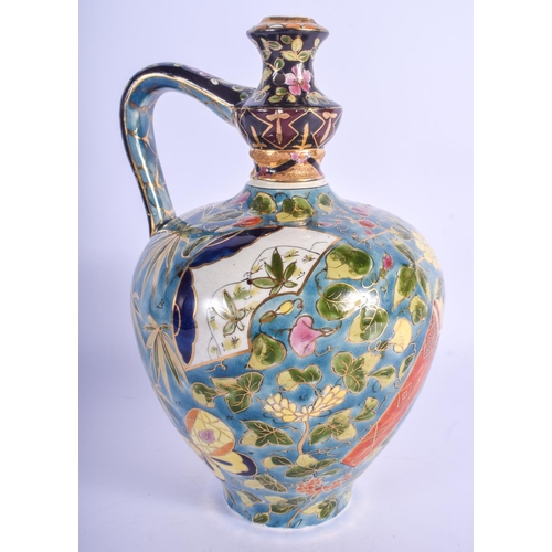 298 - A HUNGARIAN FISCHER POTTERY EWER painted with flowers. 26 cm high.