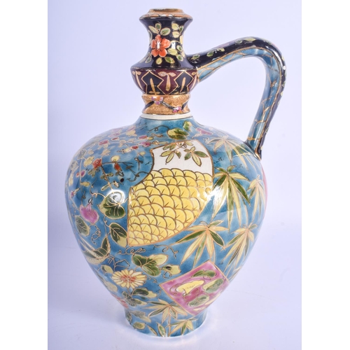 298 - A HUNGARIAN FISCHER POTTERY EWER painted with flowers. 26 cm high.