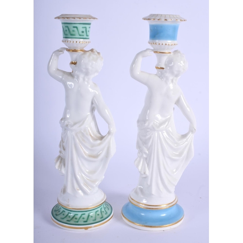 299F - A PAIR OF 19TH CENTURY EUROPEAN PORCELAIN CANDLESTICKS together with a Derby or Coalport stand, mode... 