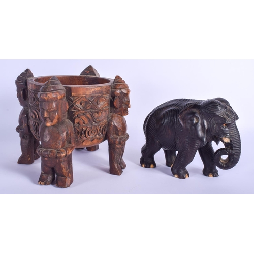 300 - AN ANTIQUE INDIAN CARVED EBONY FIGURE OF AN ELEPHANT of unusual ribbed form, together with a Tribal ... 