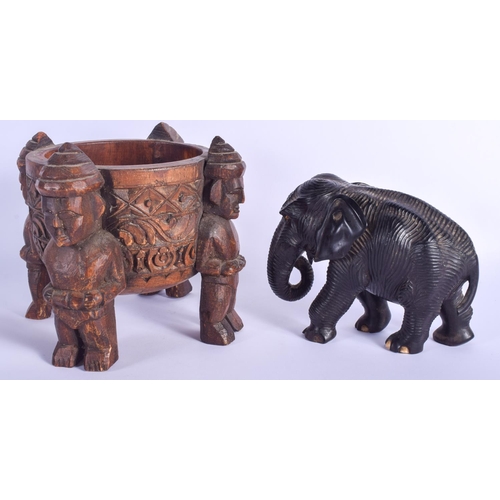 300 - AN ANTIQUE INDIAN CARVED EBONY FIGURE OF AN ELEPHANT of unusual ribbed form, together with a Tribal ... 