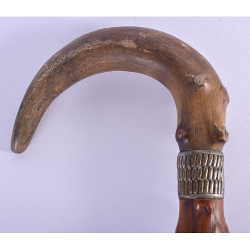 309 - A 19TH CENTURY CONTINENTAL CARVED RHINOCEROS HORN WALKING CANE. 80 cm long.