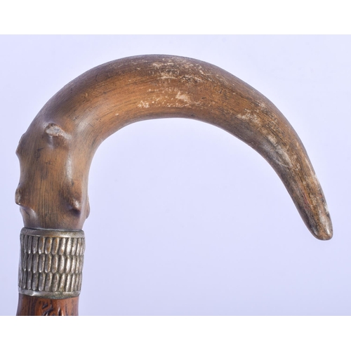 309 - A 19TH CENTURY CONTINENTAL CARVED RHINOCEROS HORN WALKING CANE. 80 cm long.