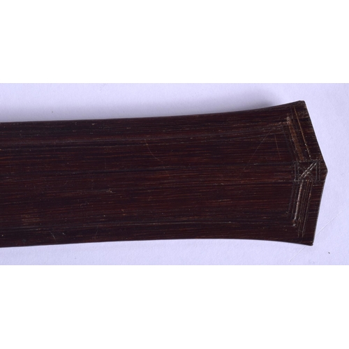 321 - A TRIBAL AUSTRALIAN CARVED WOOD BOOMERANG together with a palm wood paddle. Largest 62 cm long. (2)