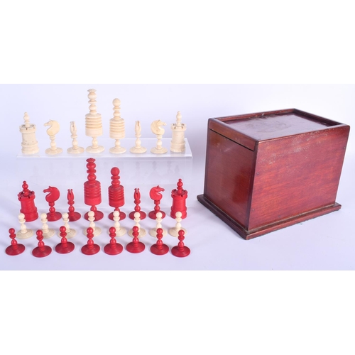 325 - A 19TH CENTURY CONTINENTAL CARVED AND STAINED BONE CHESS SET within a sliding mahogany case. Largest... 